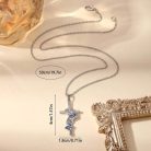 Ezüst színű kereszt nyaklánc fehér kővel